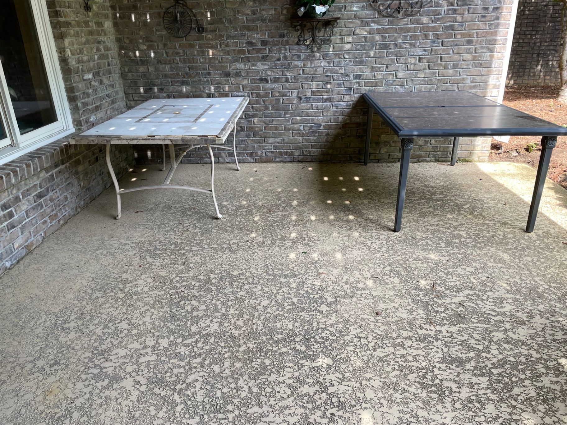 Same covered patio after pressure washing, concrete restored